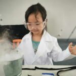 A child exploring chemistry via an experiment